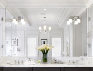 Matching Sconces And Chandeliers Keep This Bathroom Coordinated, And The Massive Mirror Doubles The Space, Making It Seem Even More Expansive