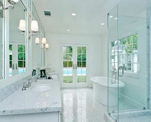 cThough This Bathroom Gets Lots Of Natural Light, The Staggered Recessed Lights And Repeating Sconces Ensure It Will Stay Bright Even After The Sun Sets