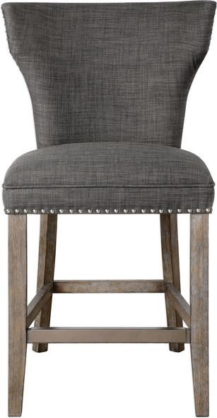 blue wingback chair Uttermost Bar & Counter Stools Chairs Supportive Comfort In A Curved Back Design, Covered With Warm Charcoal Gray Linen And Accented By Polished Nickel Nail Head Trim.  Honey-stained Frame Is Finished With Heavy Gray Wash, With An Antique Brass Finished Kick Plate. Seat Height Is 25".
