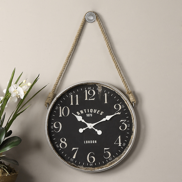 unique clock design Uttermost Wall Clocks Antiqued, Aged Ivory With Rust Undertones And Distressed Matte Black Clock Face. Rope Accent Allows It To Hang From The Decorative Hook That Is Included. Quartz Movement Ensures Accurate Timekeeping. Requires One "AA" Battery.