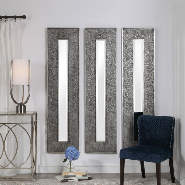 leaning mirror living room Uttermost  Metallic Mirror This Rectangular Mirror Features A Heavily Textured Surface Finished In A Metallic Silver Leaf With A Heavy Charcoal Wash Over A Solid Wood Construction. This Contemporary Design Boasts A Great Profile For Showing Individually Or Multiple For A Bold Statement. The Mirror Has A 1" Bevel And May Be Hung Horizontal Or Vertical.