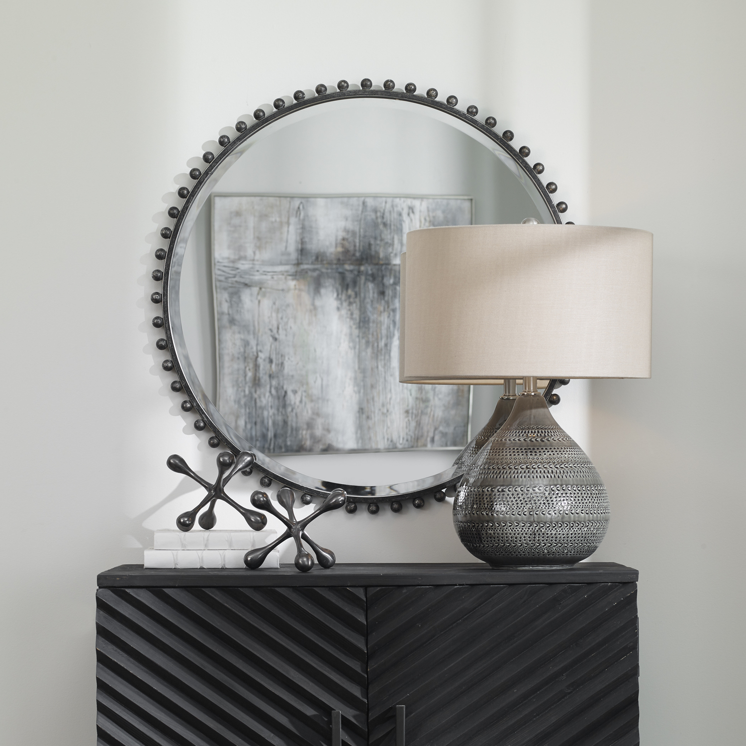 design mirror in living room Uttermost Round Iron Mirror Petite Iron Spheres Line The Outer Edge Of This Round Frame, Finished In A Distressed Black With Silver Highlights And A Light Gray Glaze. Mirror Features A Generous 1 1/4" Bevel.