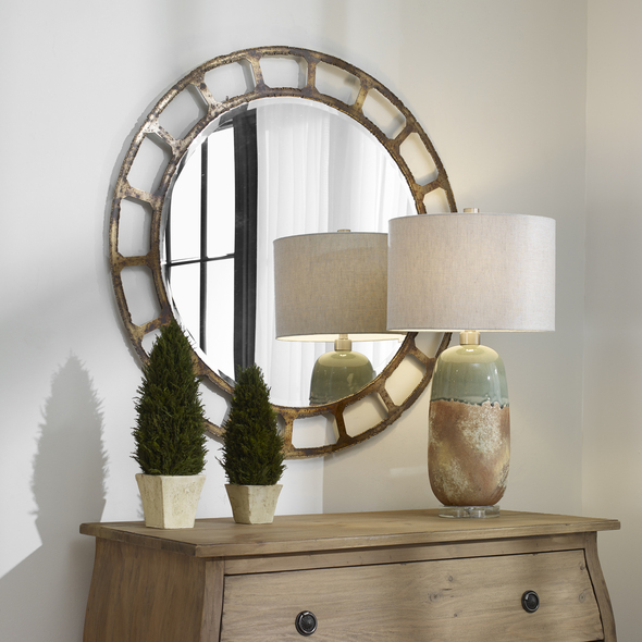 leaning mirror decor Uttermost Distressed Round Mirror Inspired By Hand Forged Industrial Styling, This Round Mirror Displays A Solid Iron Frame With Welded Bead Edges, Finished In An Aged Golden Bronze With Heavy Burnished Distressing. Mirror Features A Generous 1 1/4" Bevel.