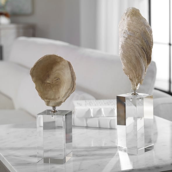 buddha statue large size Uttermost Figurines & Sculptures Cast From Natural Oyster Shells, These Sculptures Feature An Aged Ivory Finish With Chrome Accents And Set Atop Staggered Height Crystal Cube Bases.