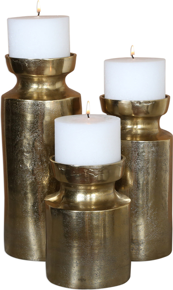 pillar candleholder Uttermost Candleholders Candleholders Set Of Three, Textured Cast Aluminum Candleholders Feature An Antiqued Brass Finish And Completed With Three 4"x 4" White Candles.