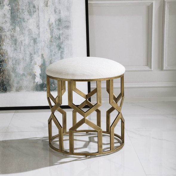 lounge chair nearby Uttermost  Accent Stools Stylish And Versatile, This Round Accent Stool Showcases A Solid Iron Base With A Modern Geometric Motif Finished In Antique Brushed Brass. The Cushioned Top Is Upholstered In A Crisp White Textured Fabric, Doubling Its Use As A Seat Or Footrest.