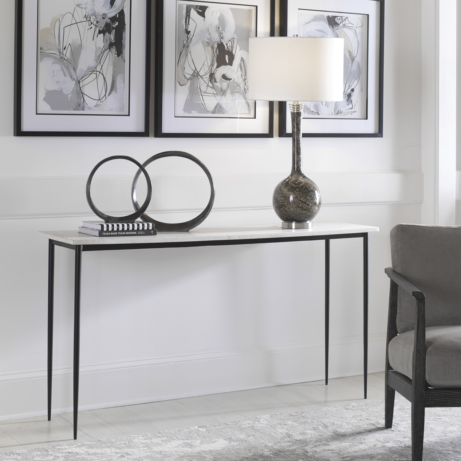 cheap black coffee table Uttermost Console Table This Modern Console Showcases An Impressive White Marble Top On A Cast Iron Base With Slender Tapered Legs In Satin Black. Because Of The Natural Characteristics Of Marble, Each Piece Will Have Unique Veining Patterns.
