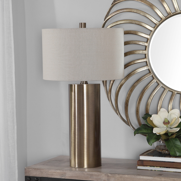 gold glass light Uttermost Taria Brushed Brass Table Lamp Finished In An Antiqued Brushed Brass, This Table Lamp Keeps It Simple Yet Upscale With A Large Metal Cylinder Base With Matching Accents.