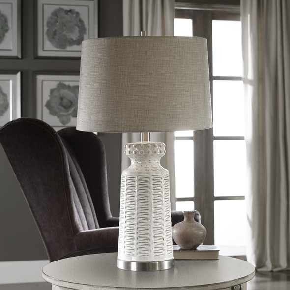 Uttermost Distressed White Table Lamp Table Lamps Embossed Ceramic, Featuring A Subtle Tribal Pattern, Finished In A Lightly Distressed Glossed White Glaze, Accented With Brushed Nickel Plated Details.