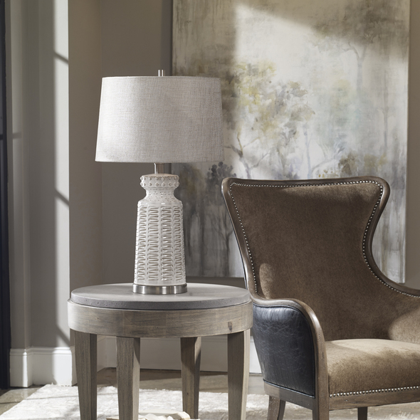 Uttermost Distressed White Table Lamp Table Lamps Embossed Ceramic, Featuring A Subtle Tribal Pattern, Finished In A Lightly Distressed Glossed White Glaze, Accented With Brushed Nickel Plated Details.