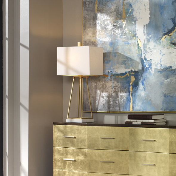  Uttermost Metallic Gold Lamp Table Lamps This Linear Design Featuring A Clean Line Tapered Steel Cage, Finished In Plated Metallic Gold, Displayed On A White Marble Foot.