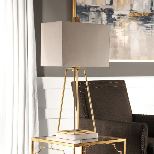  Uttermost Metallic Gold Lamp Table Lamps This Linear Design Featuring A Clean Line Tapered Steel Cage, Finished In Plated Metallic Gold, Displayed On A White Marble Foot.