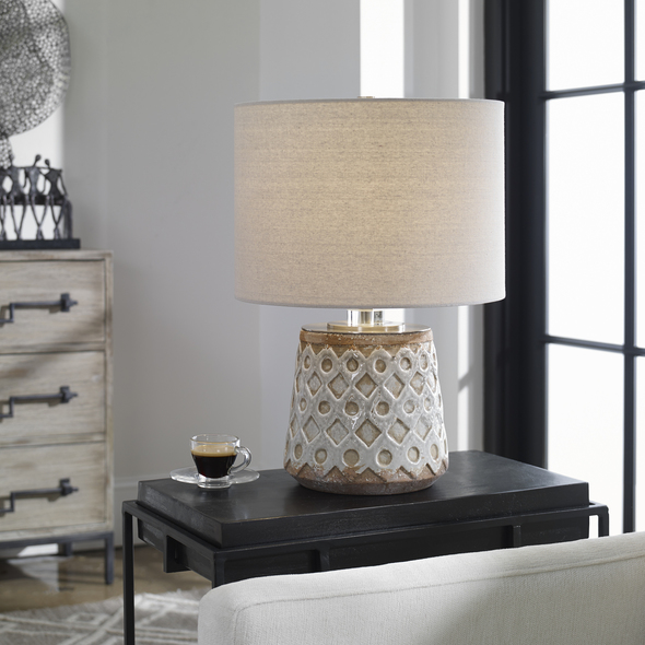 the lamp is on the desk Uttermost Old World Table Lamp A Transitional Take On An Old-world Look, This Ceramic Table Lamp Features A Heavily Distressed Blue-gray Crackle Glaze With Intricate Embossed Geometric Details, Accented With Brushed Nickel Details And A Thick Crystal Collar.