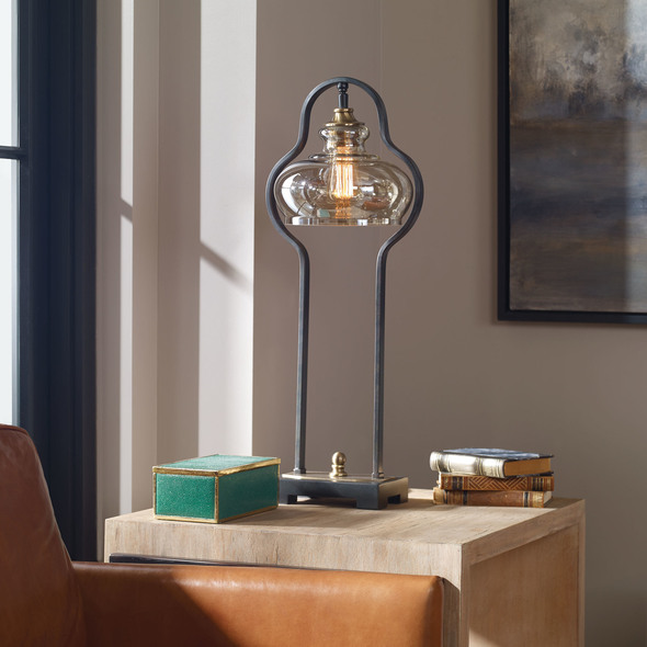black gold bedside lamp Uttermost Aged Black Desk Lamp Curvaceous Forged Iron Finished In An Aged Black, Following The Contour Of The Light Amber Glass Shade, Accented With Brushed Antiqued Brass Plated Details. One 60-watt, BT-58 Antique Style Bulb Included.