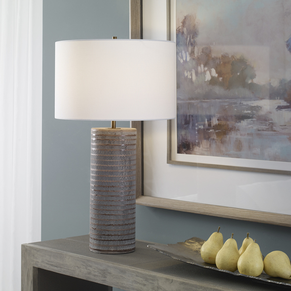 Uttermost Gray Table Lamp Table Lamps This Ceramic Table Lamp Showcases A Rustic Chiseled Texture With Frosted Pewter Gray Undertones And Organic Carved Accents In Light Sepia Tones. Iron Details Are Finished In Antique Brass.