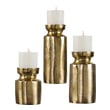 pillar candleholder Uttermost Candleholders Candleholders Set Of Three, Textured Cast Aluminum Candleholders Feature An Antiqued Brass Finish And Completed With Three 4"x 4" White Candles.