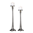 decorative wall wall candle holders Uttermost Candleholders This Set Of Two Candleholders Features A Sleek Tapered Design In Solid Cast Iron With A Subtle Porous Texture, Sealed To Preserve The Natural Finish And Accented With Gold Infused Highlights. Includes Two 3"x 3" Distressed Off-white Candles.