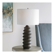 gold and white sconce Uttermost Modern Table Lamp Showcasing A Modern Lodge Style, This Table Lamp Features A Carved Wood Base Finished In A Rustic Black Stain Exposing Subtle Wood Grain.