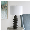 gold and white sconce Uttermost Modern Table Lamp Showcasing A Modern Lodge Style, This Table Lamp Features A Carved Wood Base Finished In A Rustic Black Stain Exposing Subtle Wood Grain.