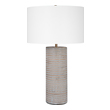 cool nightstand lamps Uttermost Gray Table Lamp This Ceramic Table Lamp Showcases A Rustic Chiseled Texture With Frosted Pewter Gray Undertones And Organic Carved Accents In Light Sepia Tones. Iron Details Are Finished In Antique Brass.